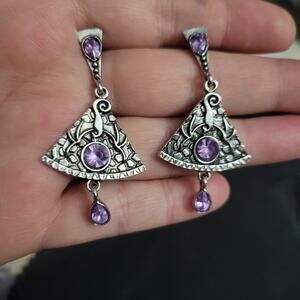 Dragon engraved drop earrings with purple crystals